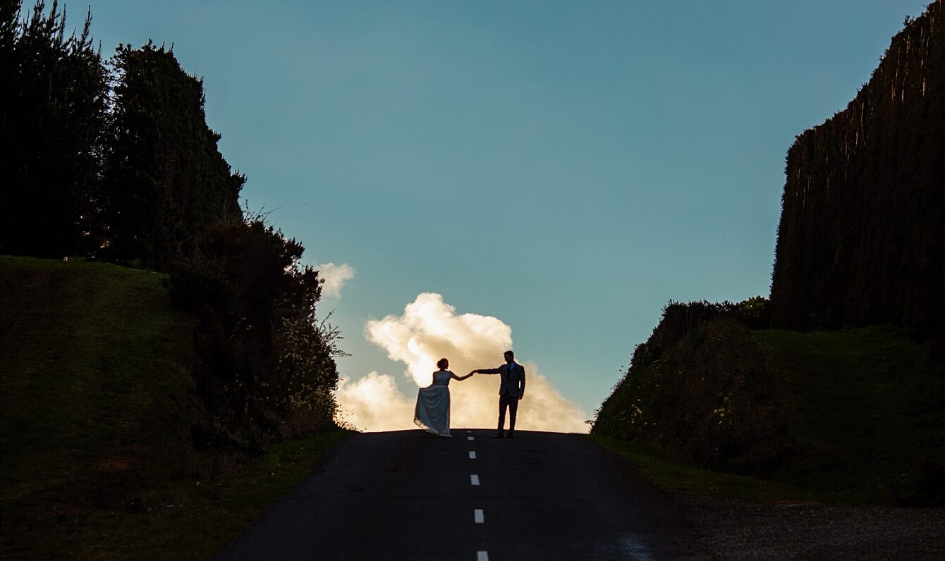 New Zealand Elopement couple cloud top of road