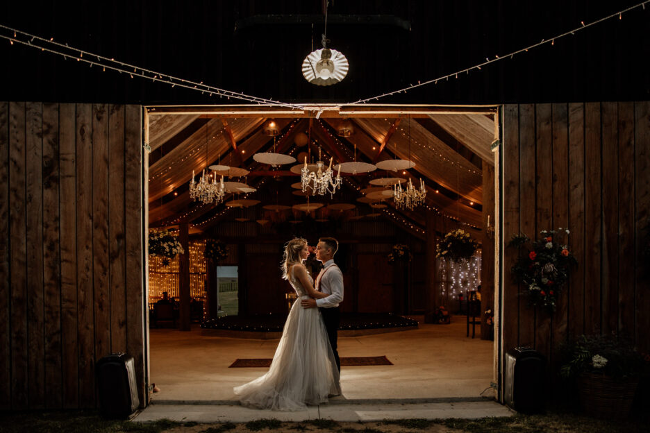 couple standing in door way of Waiterenui farm wedding venue in hawkes bay