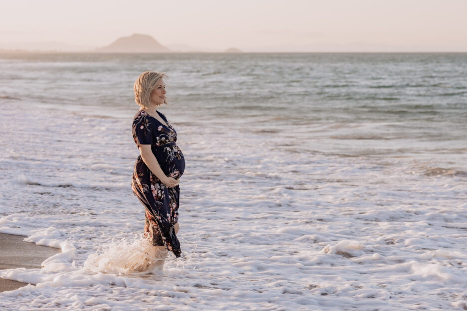Maternity photos of pregnant Mum standing in the moving sea waters