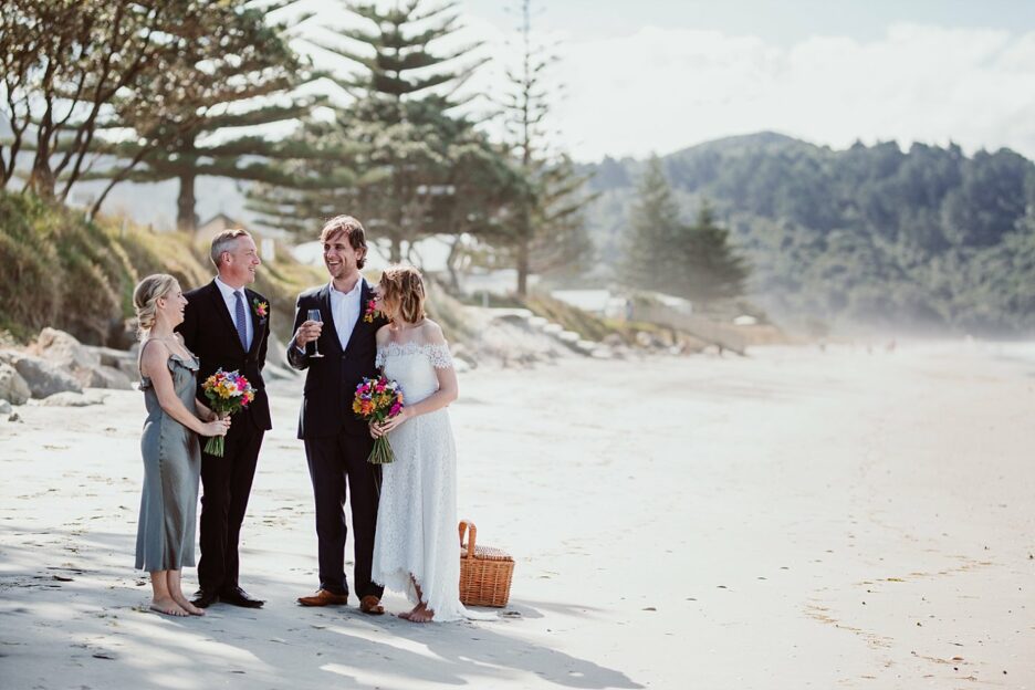 Wedding party in sage green on Waihi beach