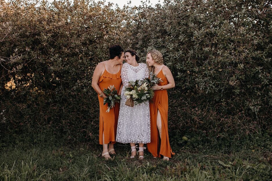 Burnt orange bridesmaids with boho Bride