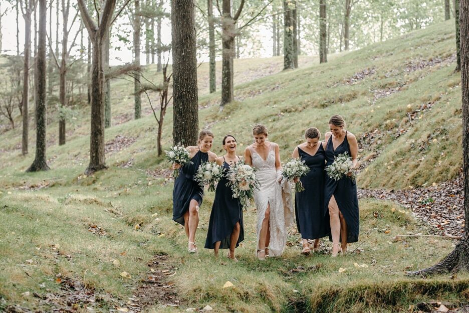 Bride with bridesmaids walking in the country wedding