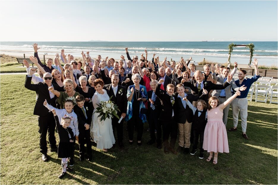 Happy wedding guests Mount Maunganui Beach wedding