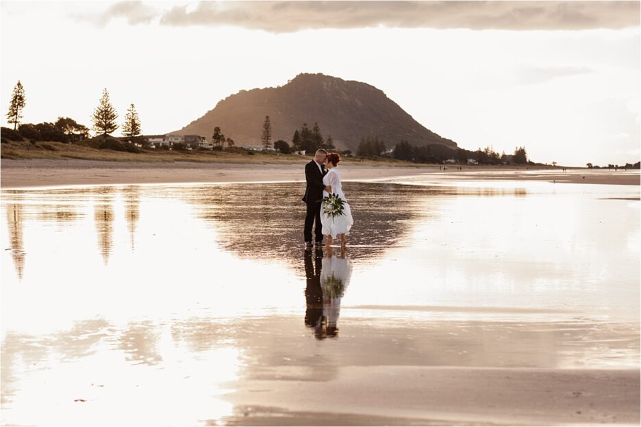 Wedding photos on Mount Maunganui beach by Pure Images Photography