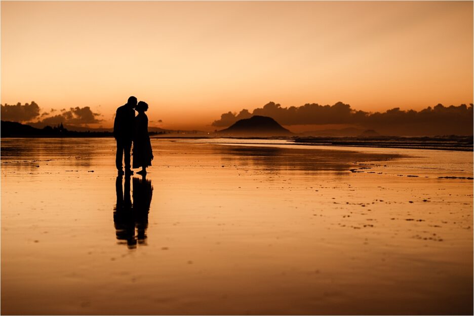 Sunset wedding photo Mount Maunganui taken by Rochelle Withell