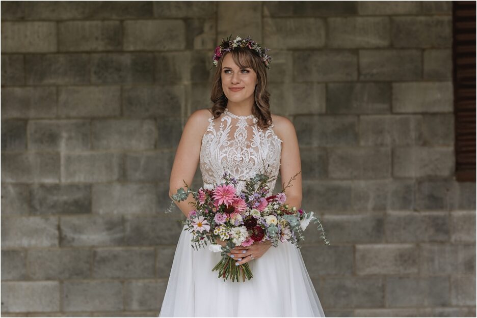 Happy bride with floral bouquet