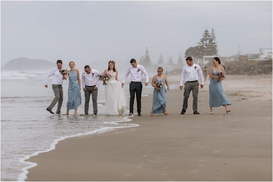 Waves at the beach with wedding party