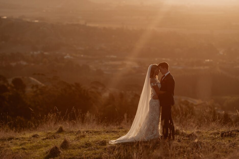 sunset elopement photography of bride and groom