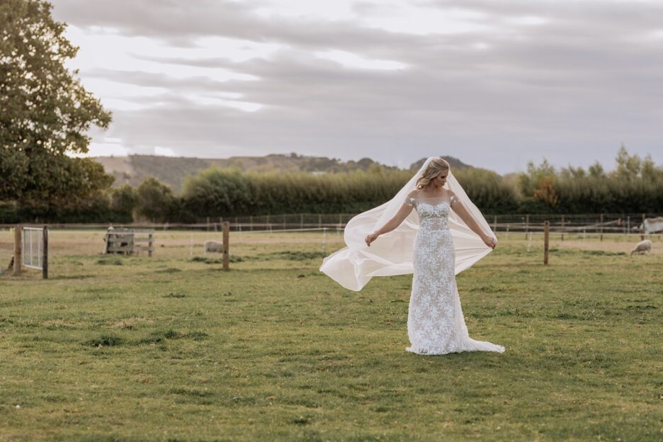 Country boho bridal dress with veil flowing