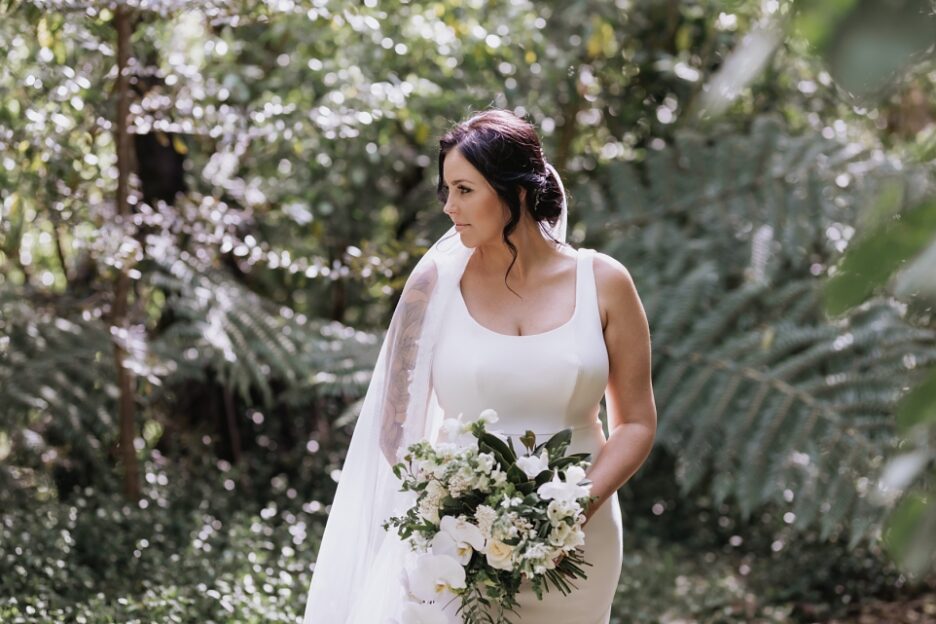 Bridal portraits of Bride in native new Zealand bush