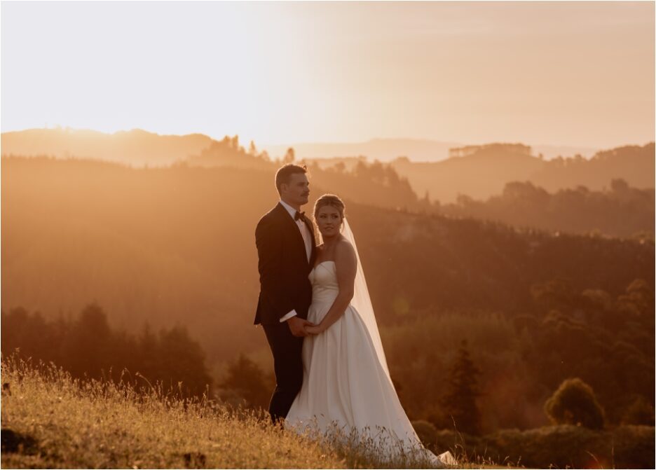 Golden hour wedding portraits with couple on hills in country scene
