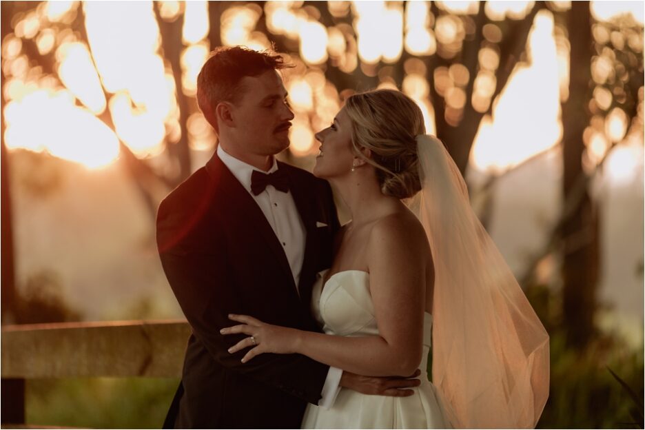 Golden hour photos of elopement with sun behind trees causing bokeh