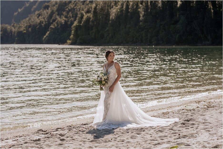 Bride in front of green lake