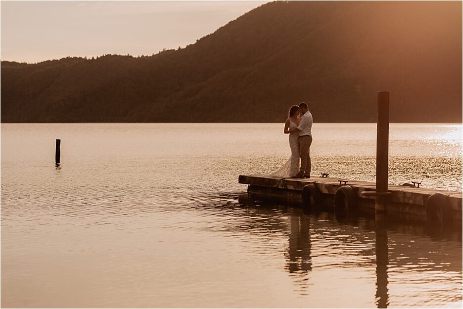 Sunset photos on Lake Okataina of bridal couple