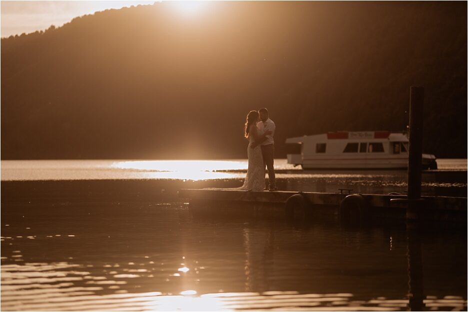 Wedding photos of golden hour with the sun and water glistening