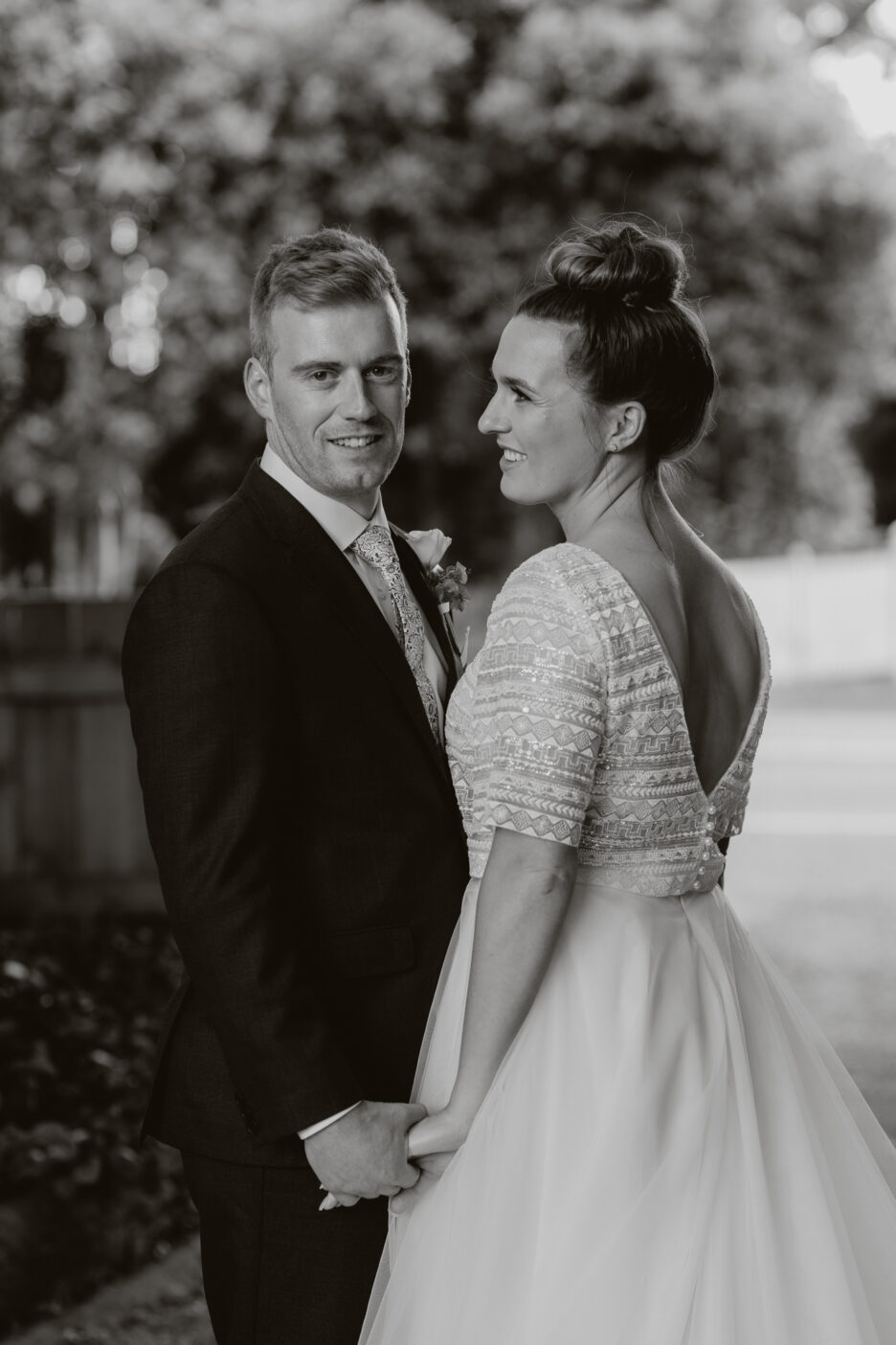 Black and white with bridal couple on driveway
