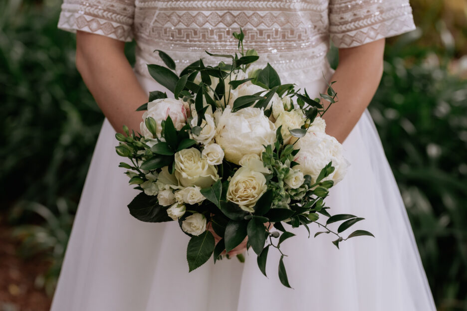 Bride with bouquet green and cream