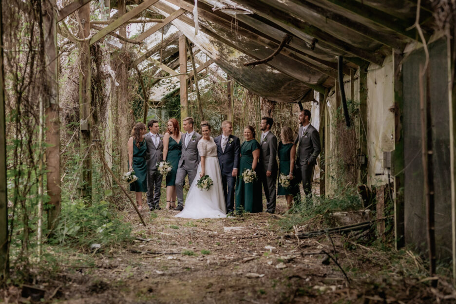 Bridal party in old abandoned glasshouse