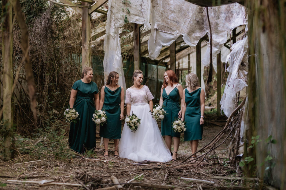Bridesmaids with bride in abandoned old building