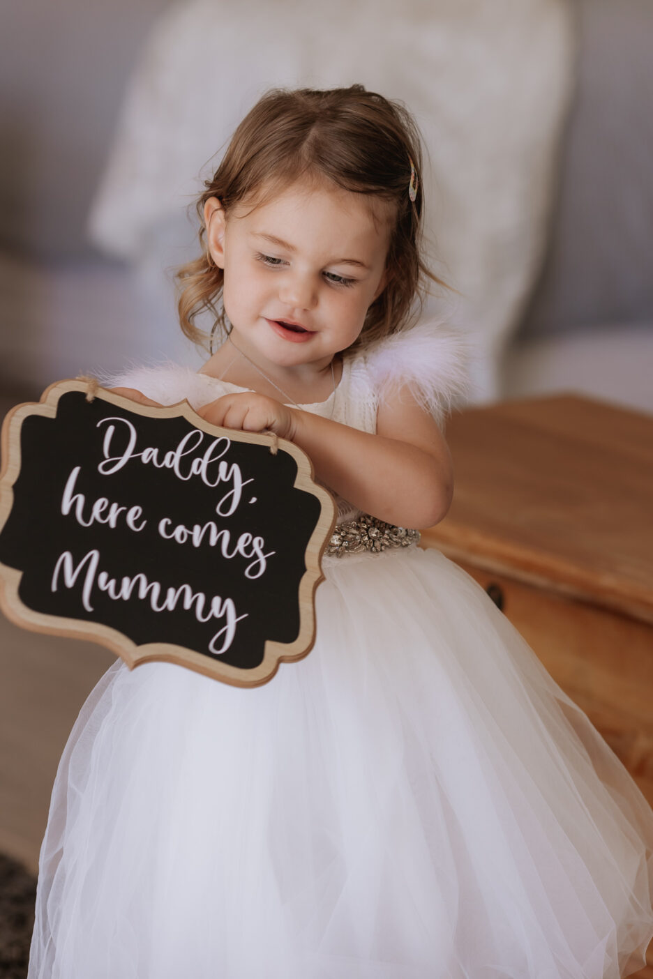 Flowergirl with Daddy here comes Mummy sign