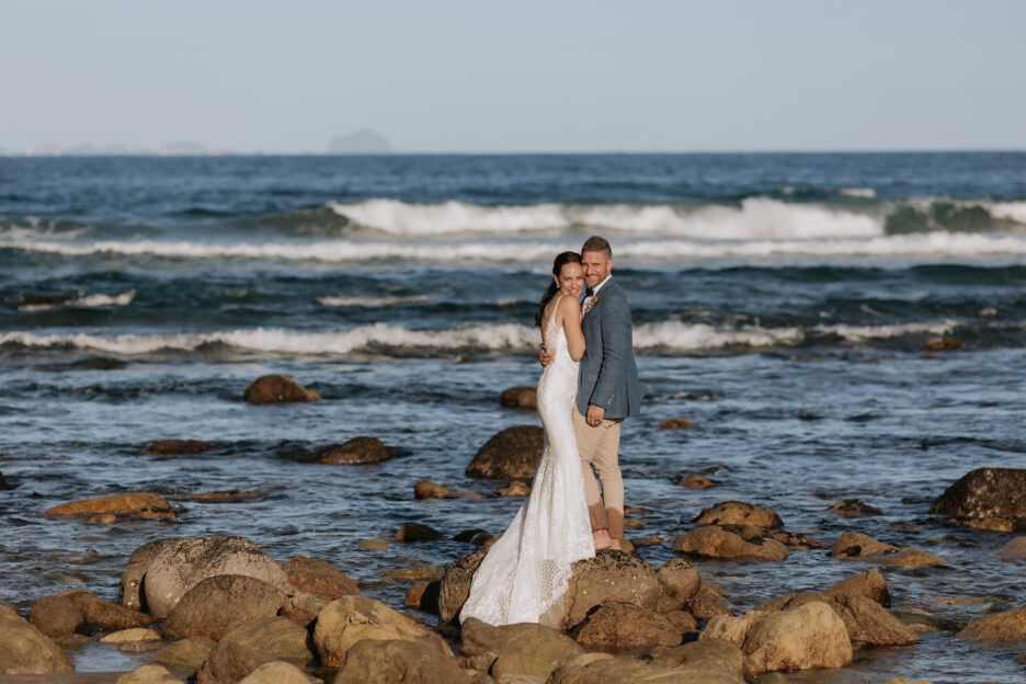 Wedding photography on the rocks at Orua Beach house