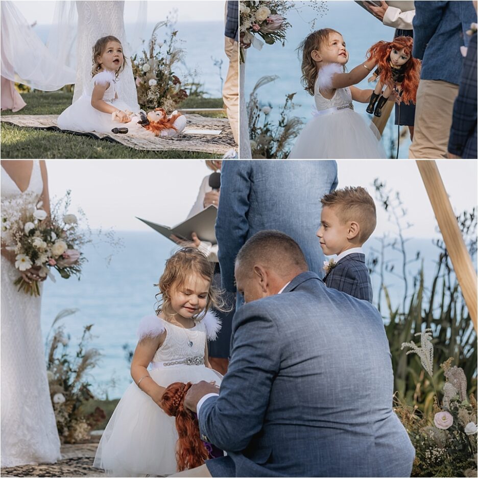 Best man helps flower girl with her doll