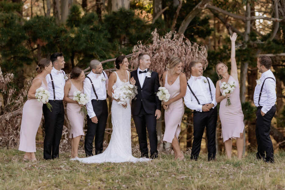 Pink bridal party in the country having fun