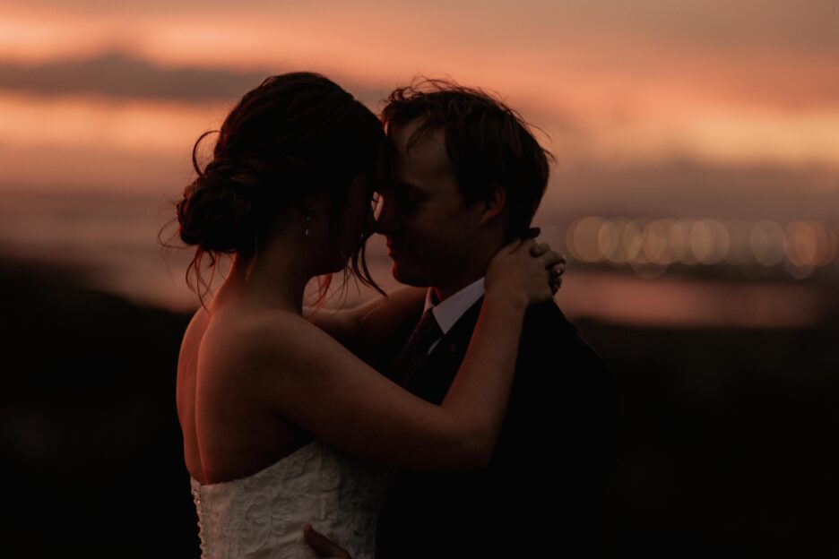 Late golden light of bride and groom embracing