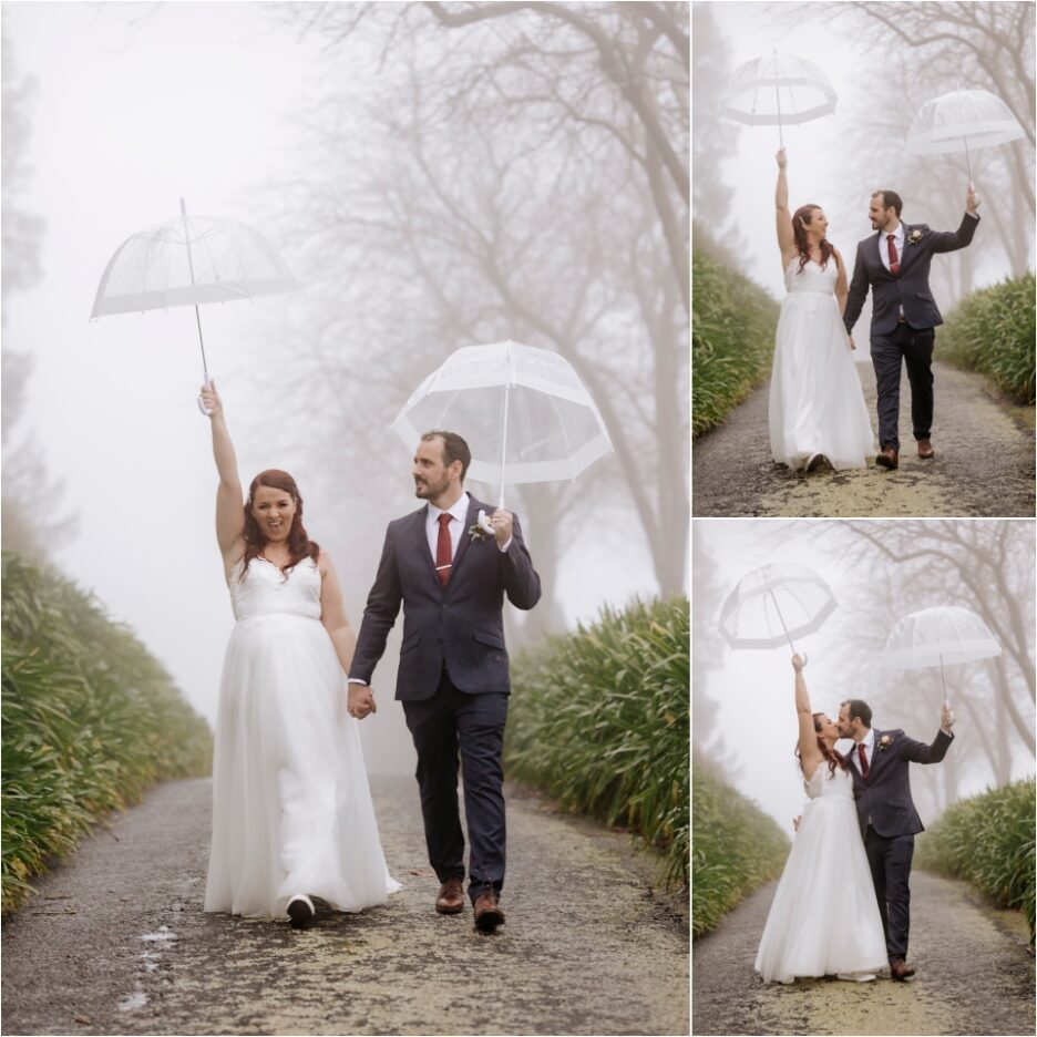 Celebrating wedding photos in the rain on driveway holding up umbrellas