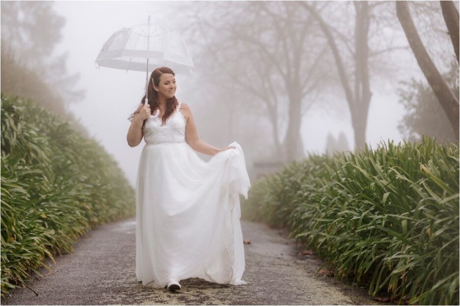 Bride walking in the rain in the clouds