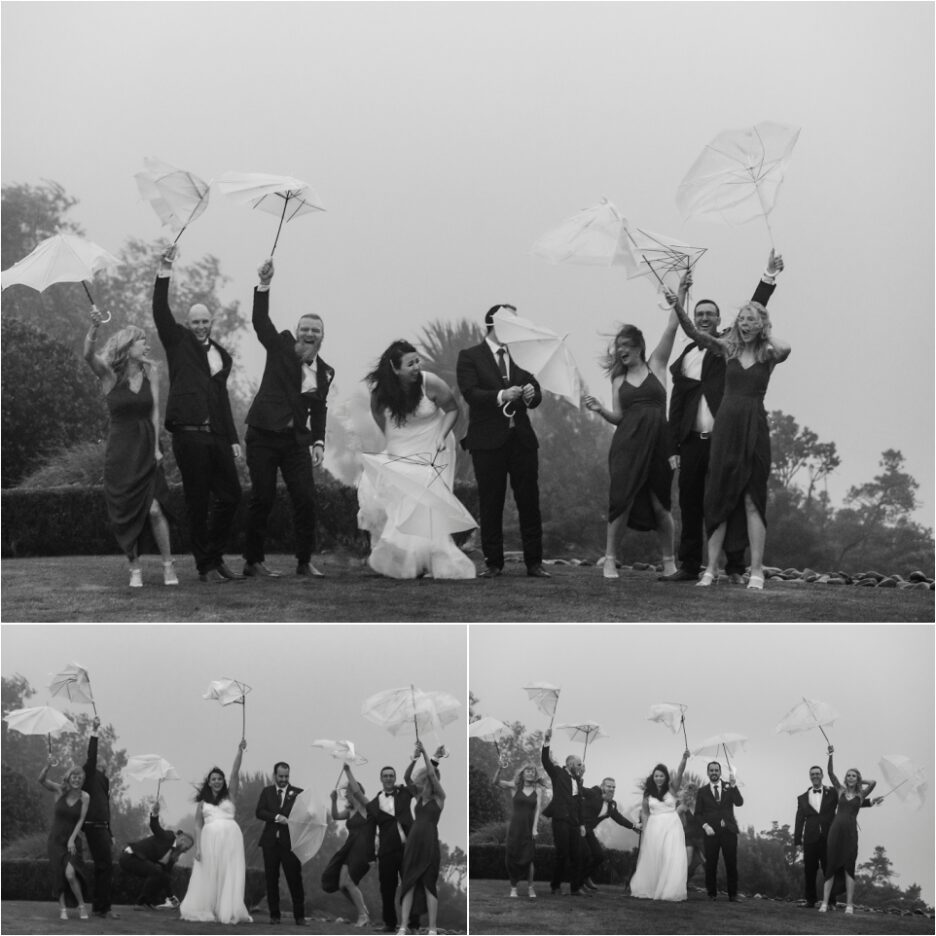 wedding party umbrellas blown inside out party laughing having fun