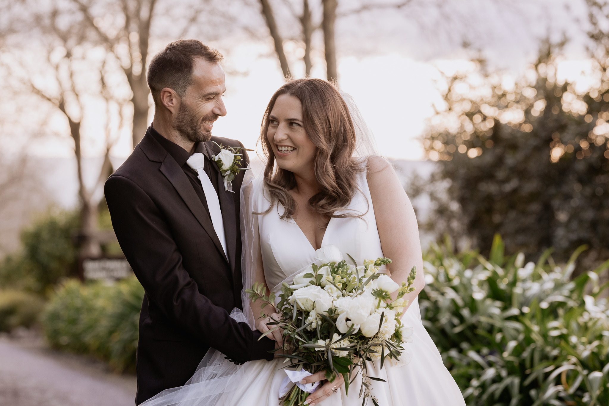 bride and groom laughing