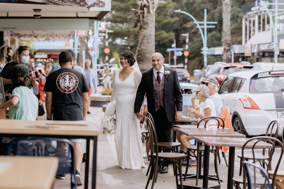 Urban wedding photos walking the main street Mount Maunganui shops