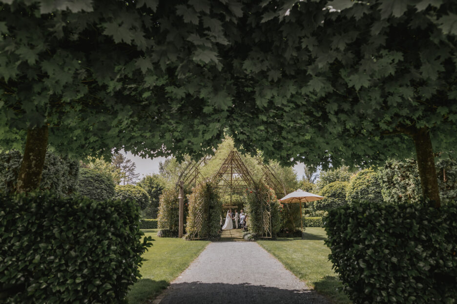 wedding ceremony looking through trees at Tree church Ohaupo Hamilton