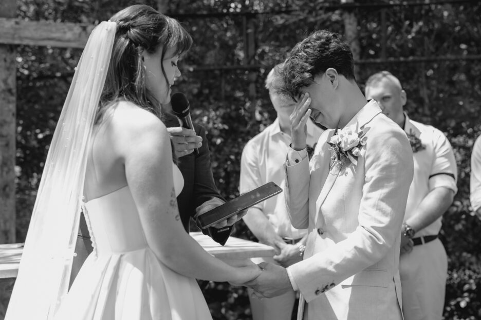 Groom cries while bride reads vows in Spanish