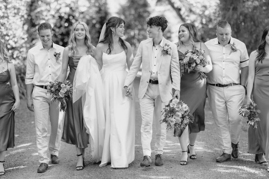 wedding party walking on driveway