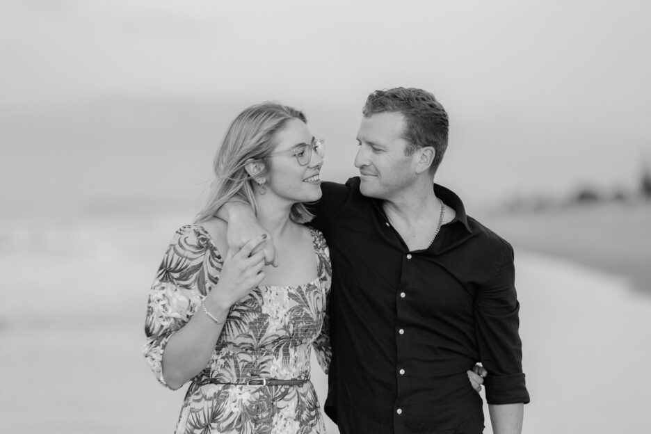 couple in love walking together during beach engagement session