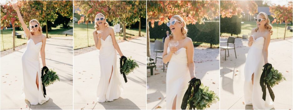 happy laughing bride in modern dress with love heart glasses drinking champagne