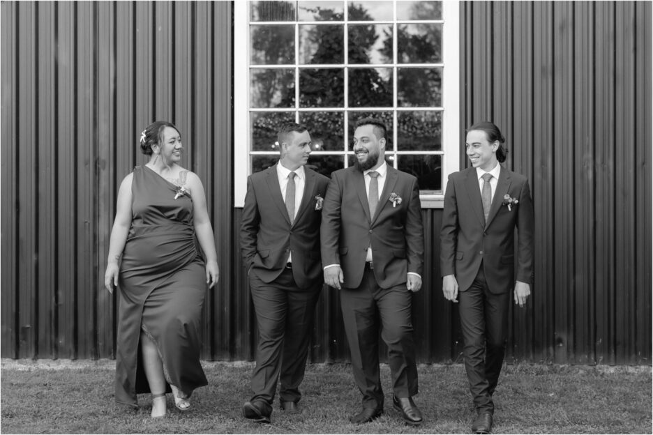 groom walking with his groomsmen ebony vines