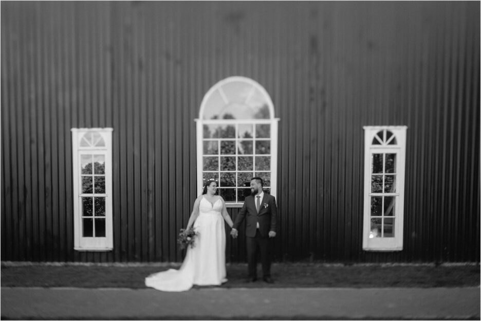 vintage photo of ebony vines packing shed with bridal couple