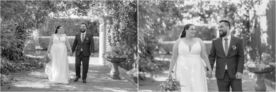 black and white wedding photos of bride and groom walking in courtyard at Ebony vines