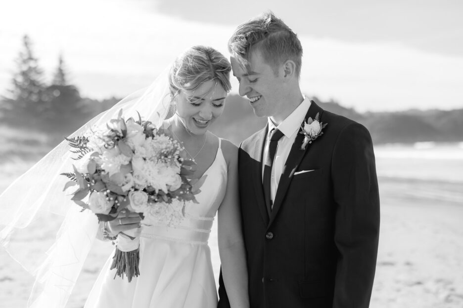 special moment between bride and groom looking down while walking