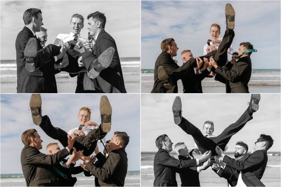 groomsmen throwing groom in air catching