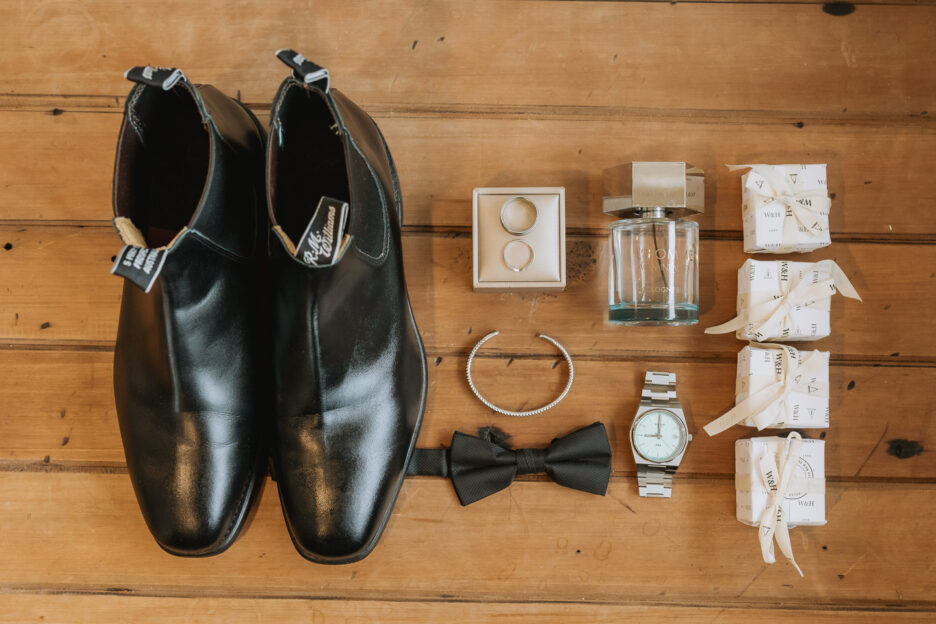 grooms attire, boots, bow tie, gift boxes, aftershave cologne