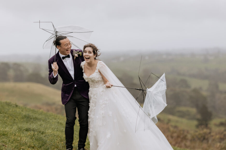 fun in the hills as brides umbrella breaks groom laughing