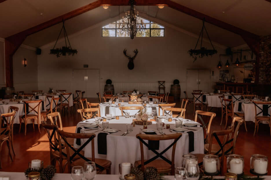 Cosy table setting of wedding reception  pine cone decorations