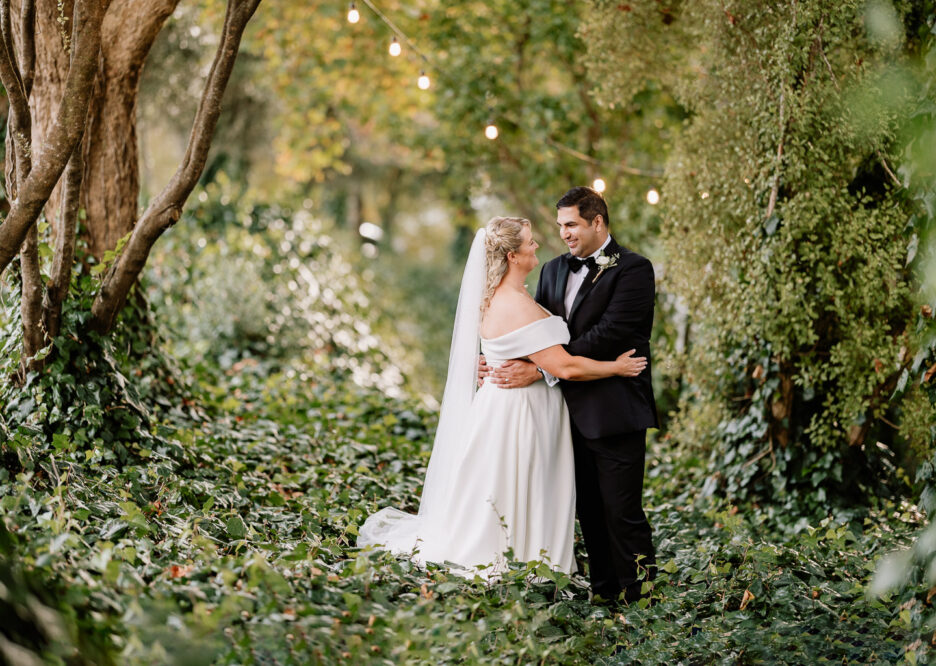 Wedding photo taken in green ivy bush